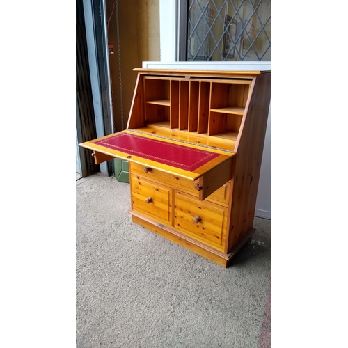 88 - Pine writing bureau with red leather inlay and fitted interior