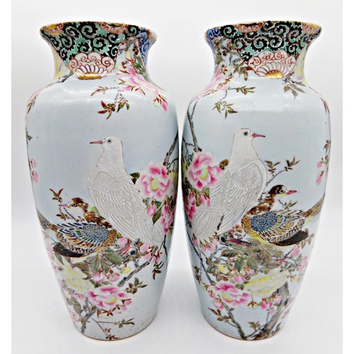 83 - Pair of late 19th century Chinese porcelain vases, enamelled with doves amidst blossom, 38cm high