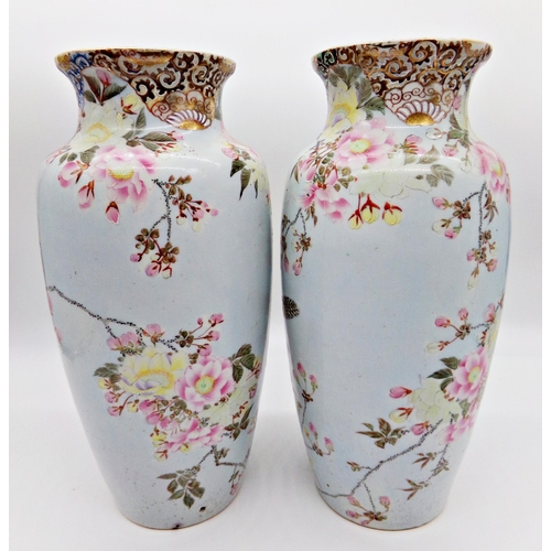 83 - Pair of late 19th century Chinese porcelain vases, enamelled with doves amidst blossom, 38cm high