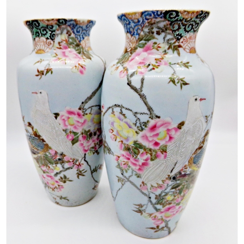 83 - Pair of late 19th century Chinese porcelain vases, enamelled with doves amidst blossom, 38cm high