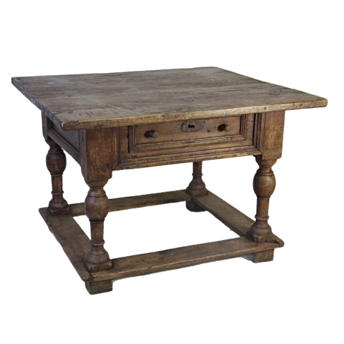 523 - 17th century Dutch oak centre table, fitted with a single drawer on four baluster turned supports un... 