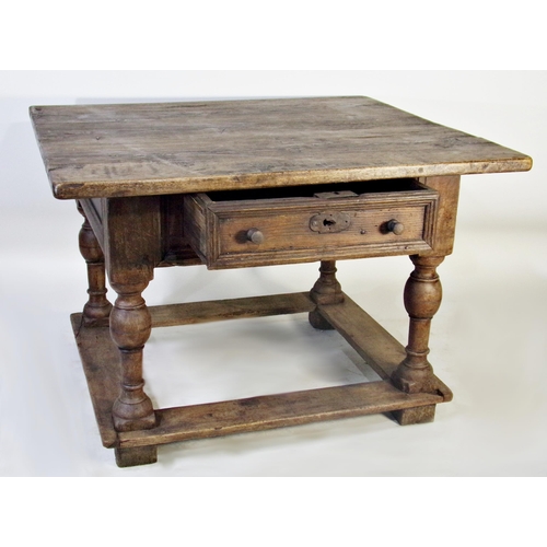 523 - 17th century Dutch oak centre table, fitted with a single drawer on four baluster turned supports un... 