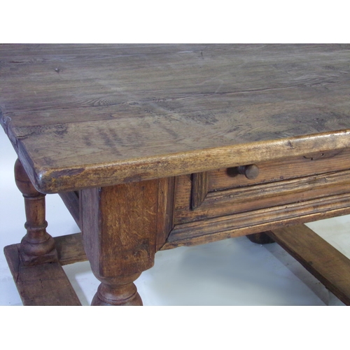 523 - 17th century Dutch oak centre table, fitted with a single drawer on four baluster turned supports un... 