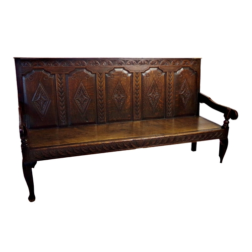 532 - 18th century oak five panel back settle, carved floral decoration, later elm seat, cabriole front le... 