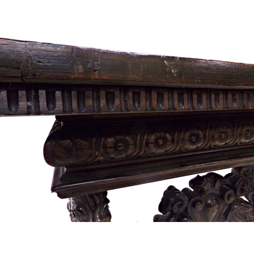 541 - 17th century and later oak twin pillar refectory table, the base carved with mythical winged lions o... 