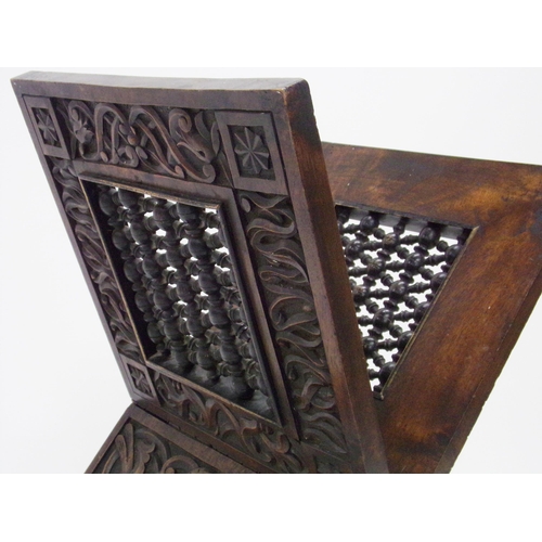 548 - Good quality folding Quran stand, with carved pierced geometric panels and further well carved base ... 