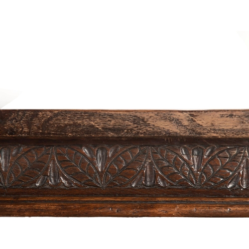 552 - Impressive 17th century style refectory table, thick oak top over a carved floral frieze and six bal... 