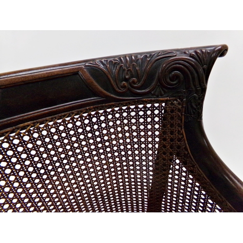 555 - Good quality late Regency Bergere library chair, carved scrolled frame, drop in seat and good turned... 