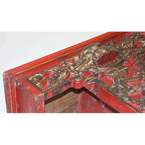 105 - Antique Chinese carved and red lacquered bed panel or pelmet, with gilt highlights, carved with bird... 