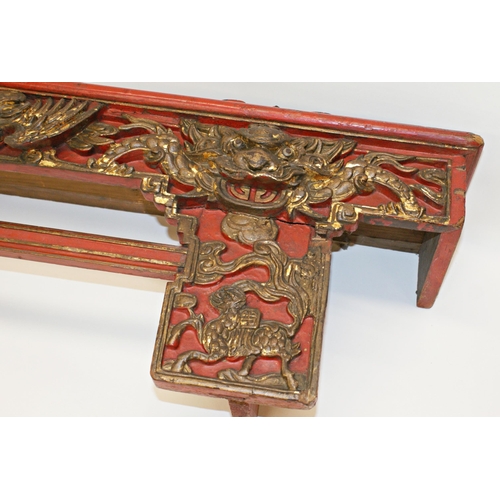 105 - Antique Chinese carved and red lacquered bed panel or pelmet, with gilt highlights, carved with bird... 