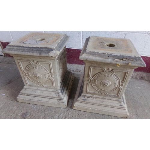 21 - Pair of glazed pottery square plinths, flower head relief and stepped square bases, 52 x 38cm