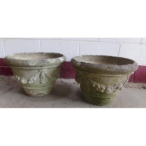 39 - Pair of reconstituted stone planters, with swag relief decoration, 34cm high x 50cm diameter