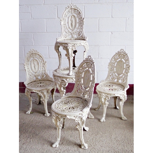 42 - Exceptional quality cast iron terrace set in the manner of Coalbrookdale, the chairs mounted with a ... 