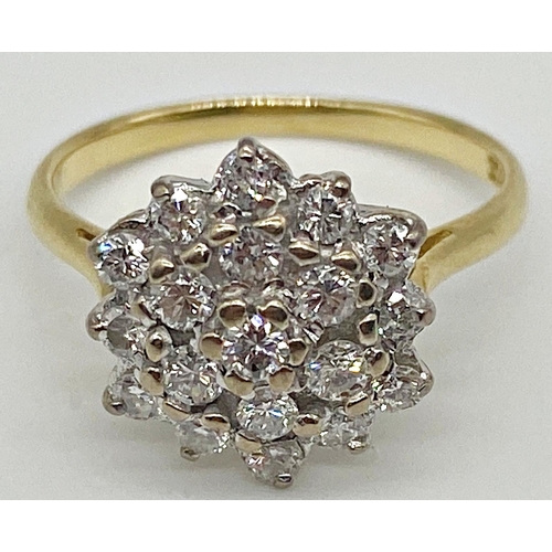 301 - An 18ct diamond cluster ring with 19 .05ct diamonds in a white gold setting. Size K, 3.1g approx