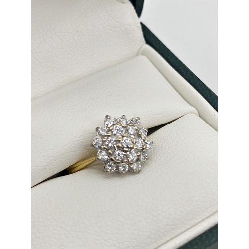 301 - An 18ct diamond cluster ring with 19 .05ct diamonds in a white gold setting. Size K, 3.1g approx