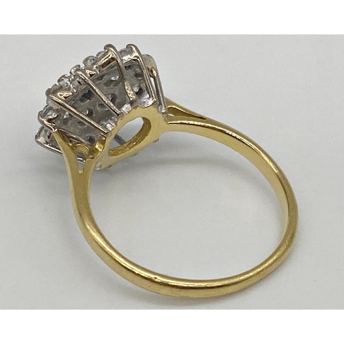 301 - An 18ct diamond cluster ring with 19 .05ct diamonds in a white gold setting. Size K, 3.1g approx