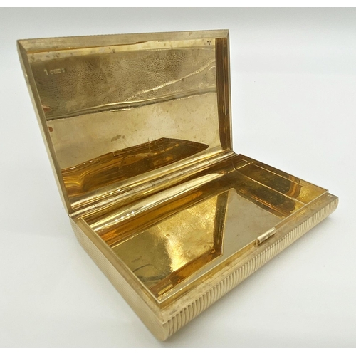 360 - A 9ct gold cigarette case with engine turned lined detailing and hidden clasp worked into the design... 