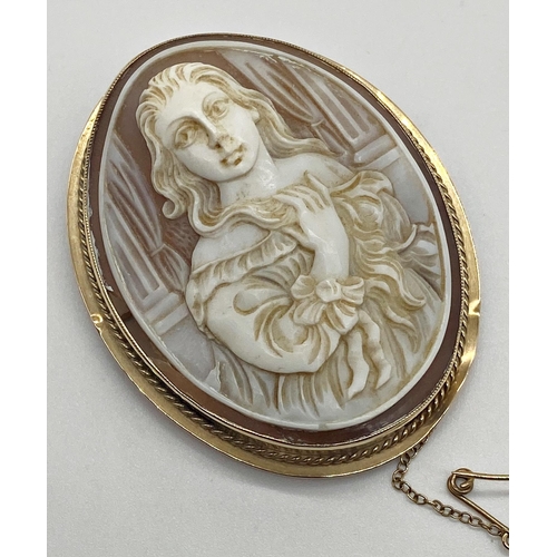 320 - Cameo brooch depicting a classic maiden with flowing hair set into a 9ct gold mount 5 cm x 4 cm appr... 