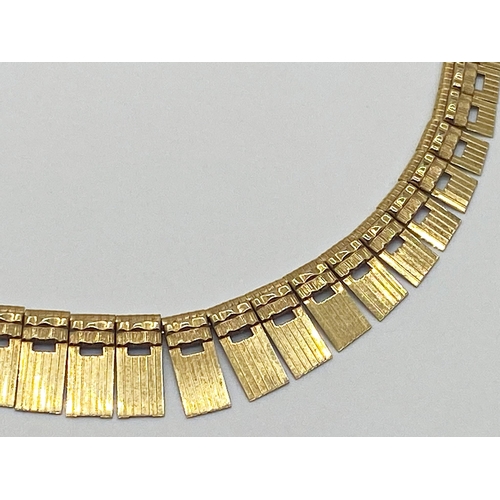 322 - A 9ct gold graduated fringe necklace stamped 375 West Germany. 21 g approx.