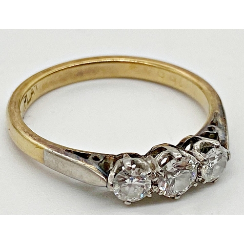 330 - An 18ct three stone platinum set diamond ring central .25ct flanked by two .15ct stones, Size O, 3.1... 