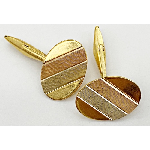 331 - A pair of 18ct gold cufflinks with tri colour gold to the front incorporating two burnished panels i... 