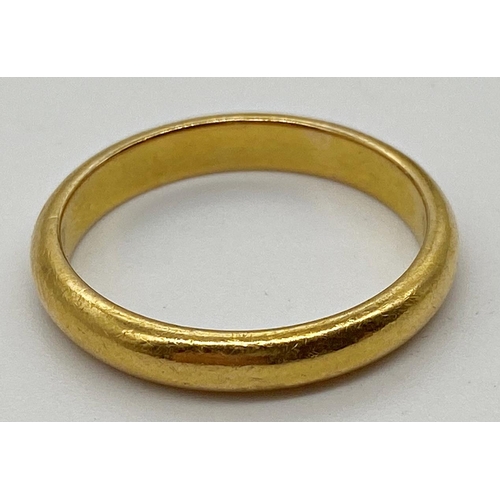 339 - A 22ct gold wedding band, size N 1/2. Weight 4.57 g approx.