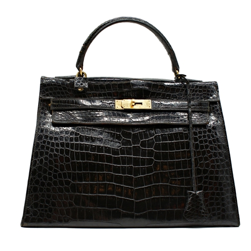 499 - Rare 1959 Hermes of Paris crocodile leather Kelly bag, with padlock, key and suede dust cover, 23 x ... 