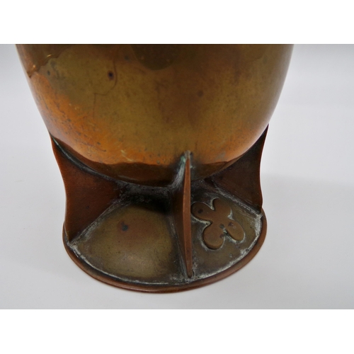 127 - Arts and Crafts copper jug of tall organic baluster form, with segmented base and unusual flower hea... 