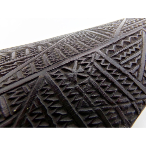 115 - Good 18th century Tonga Akau war club, with hand carved geometric patterns and abstract figural moti... 