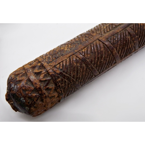 115 - Good 18th century Tonga Akau war club, with hand carved geometric patterns and abstract figural moti... 