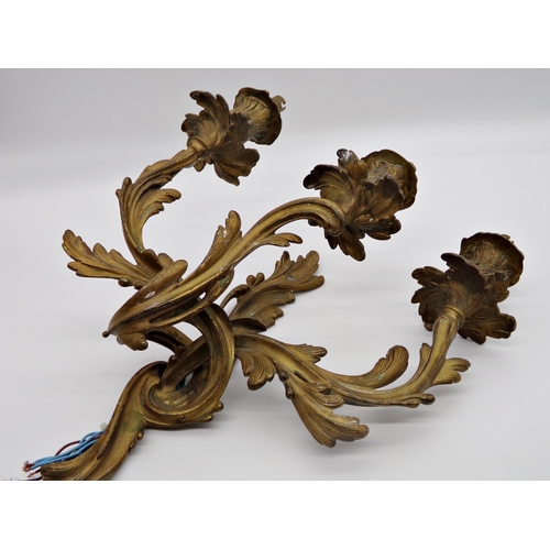 593 - Pair of French early 20th century Louis XV style gilt cast metal three branch acanthus wall sconce, ... 