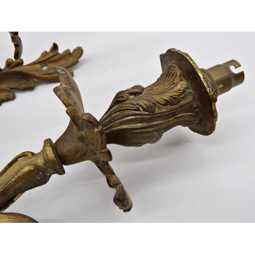 593 - Pair of French early 20th century Louis XV style gilt cast metal three branch acanthus wall sconce, ... 