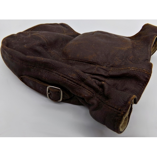 11 - Early leather flying or driving helmet, with suede interior with a pair of matching racing goggles (... 