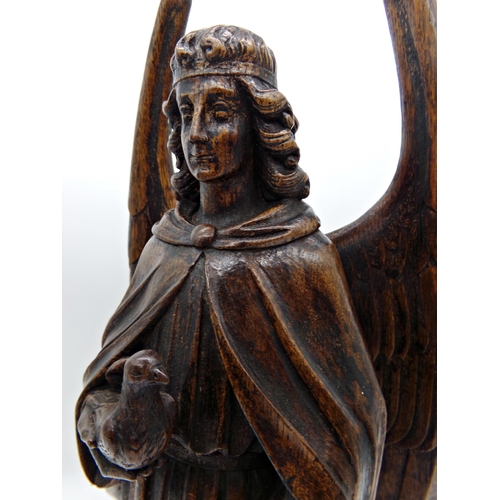 143 - Good quality antique Flemish oak carving of an angel holding a dove, 51cm high