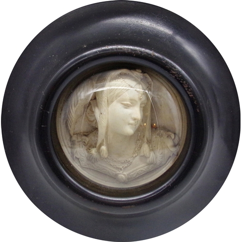 144 - Good quality 19th century plaster bust of an exotic lady within an ebonised convex frame, 21.5cm dia... 