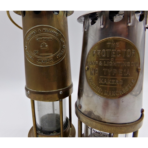 147 - Two E Thomas & Williams Welsh brass miners lamps, No 62078 & HS11168 with a further The Protector Ty... 