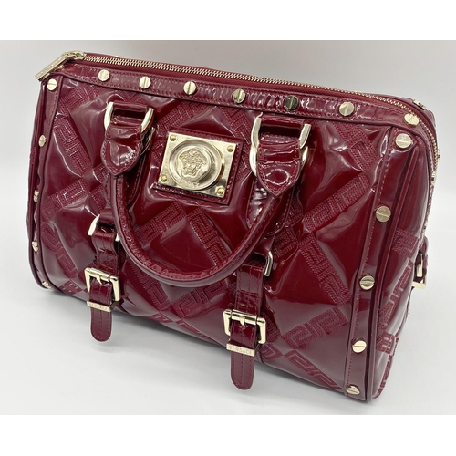 496 - Versace 'Snap Out Of It' bag, in deep red, in as new condition, original dust bag and guarantee card... 