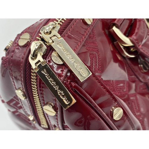 496 - Versace 'Snap Out Of It' bag, in deep red, in as new condition, original dust bag and guarantee card... 