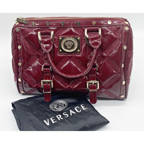 496 - Versace 'Snap Out Of It' bag, in deep red, in as new condition, original dust bag and guarantee card... 