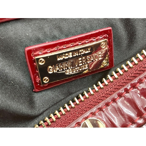 496 - Versace 'Snap Out Of It' bag, in deep red, in as new condition, original dust bag and guarantee card... 