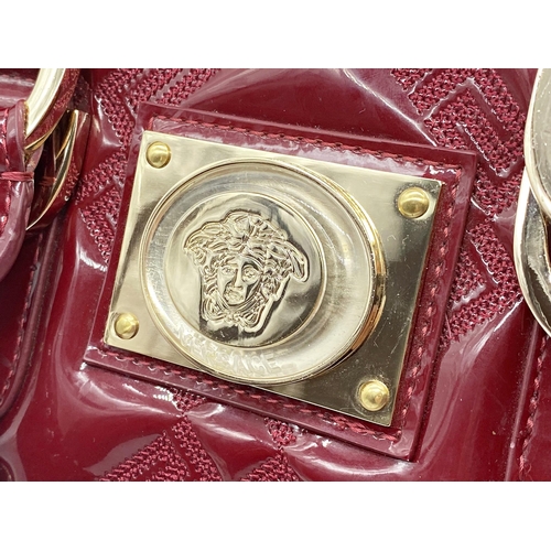 496 - Versace 'Snap Out Of It' bag, in deep red, in as new condition, original dust bag and guarantee card... 