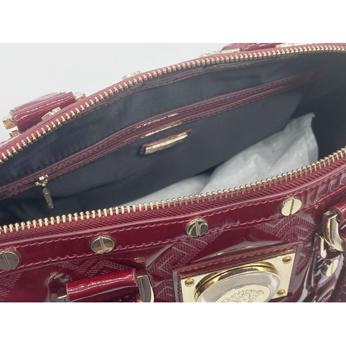 496 - Versace 'Snap Out Of It' bag, in deep red, in as new condition, original dust bag and guarantee card... 