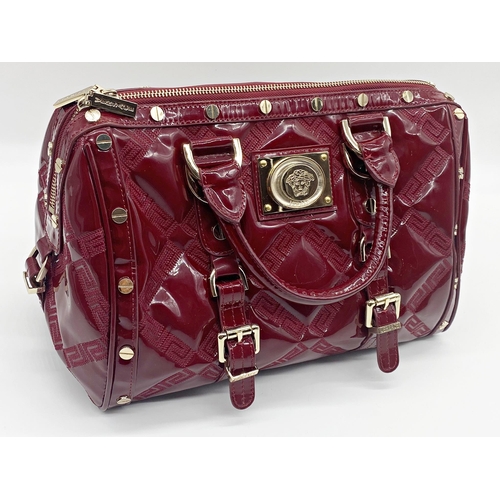 496 - Versace 'Snap Out Of It' bag, in deep red, in as new condition, original dust bag and guarantee card... 