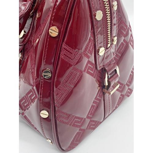 496 - Versace 'Snap Out Of It' bag, in deep red, in as new condition, original dust bag and guarantee card... 