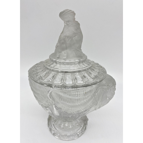 66 - Good quality Baccarat pressed jar candy jar and cover, the lid mounted by a seated Eastern figure, w... 