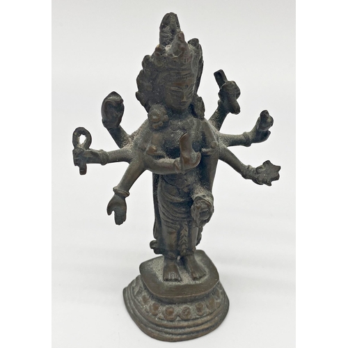 96 - Small antique Chinese bronze figure of a standing Buddhist Deity with eight arms, possibly Amoghapas... 