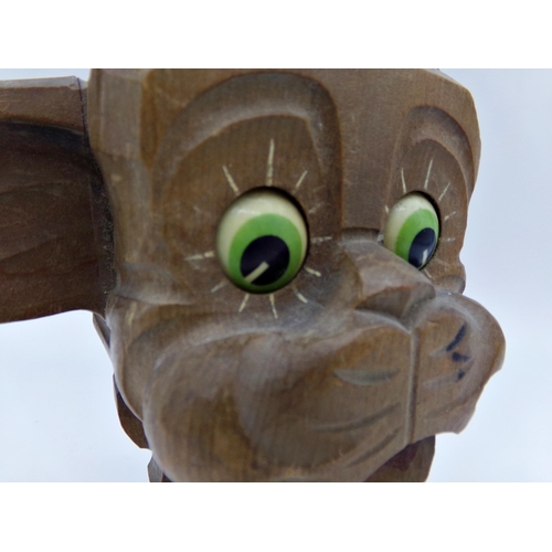 476 - Novelty carved wooden dog clock, with moving eyes, 17cm high