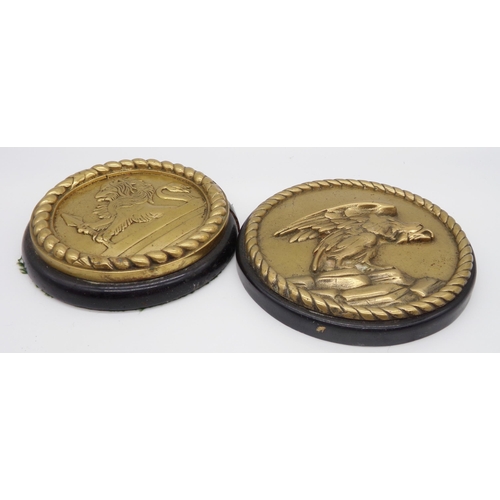 160 - Pair of antique polished bronze circular wall plaques, both cast in relief, one with an eagle the ot... 