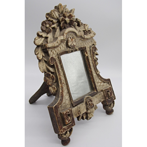 161 - Good antique continental carved and painted pine easel mirror, mounted with a floral bouquet with fu... 