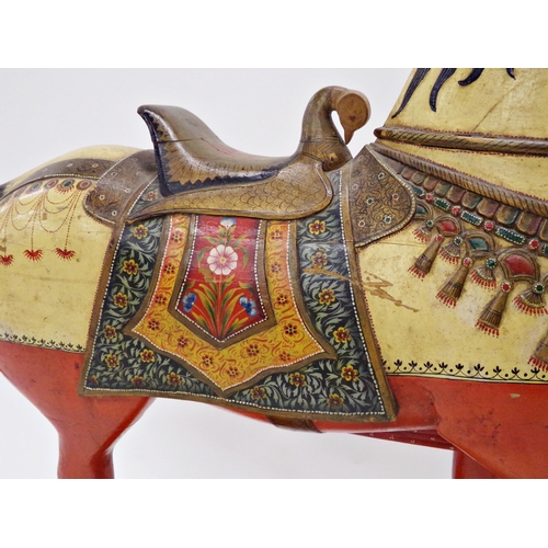 101 - Good quality Indian folk art carved wooden horse on wheels, with hand painted decoration, 82 x 86cm